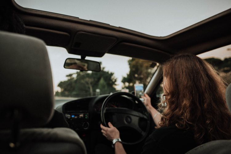 young woman driving her car